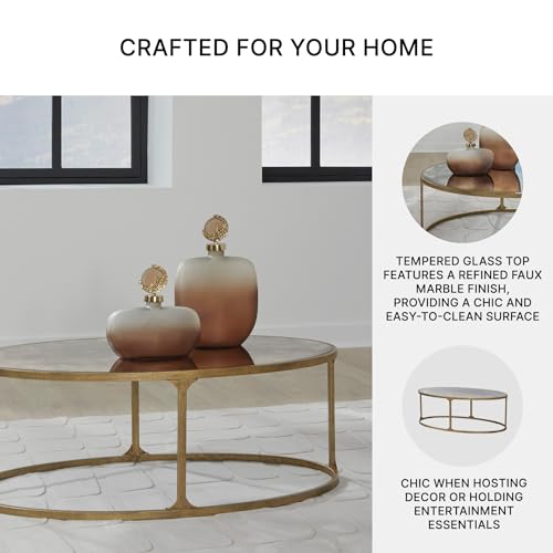 Signature Design by Ashley Korajane Oval Coffee Table with Tempered Glass Top, Faux Marble Finish, Steel Frame, 48" W x 27.38" D x 17.5" H, Antique Gold Signature Design by Ashley