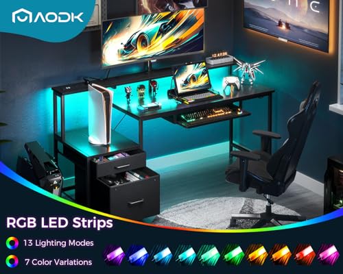 AODK 55 Inch Gaming Desk with Power Outlets & LED Light, Reversible Computer Desk with File Cabinet and Fabric Drawer, Office Desk with Keyboard Tray, Table with Full Monitor Riser and PC Stand, Black AODK