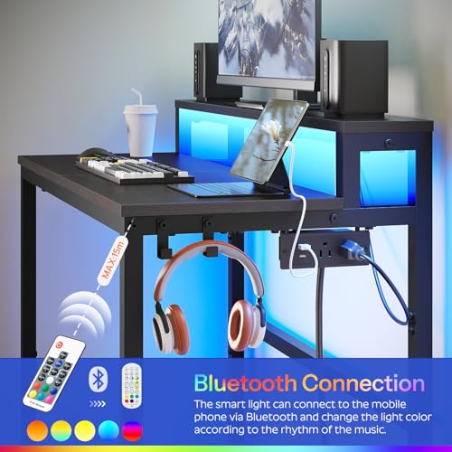 YATINEY Small Computer Desk with Charging Station and LED Lights, Gaming Desk with Monitor Stand, 2-Tier Home Office Desk with 4 Side Hooks, for Living Room, Home Office, Black DN01UDBBY2 YATINEY