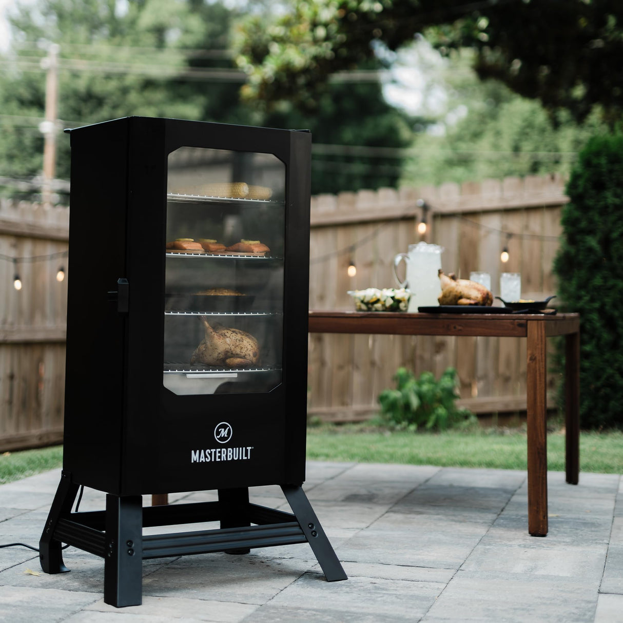 Masterbuilt® 30-inch Digital Electric Vertical BBQ Smoker with Leg Kit, Side Wood Chip Loader and 710 Cooking Square Inches in Black, Model MB20070421 Masterbuilt