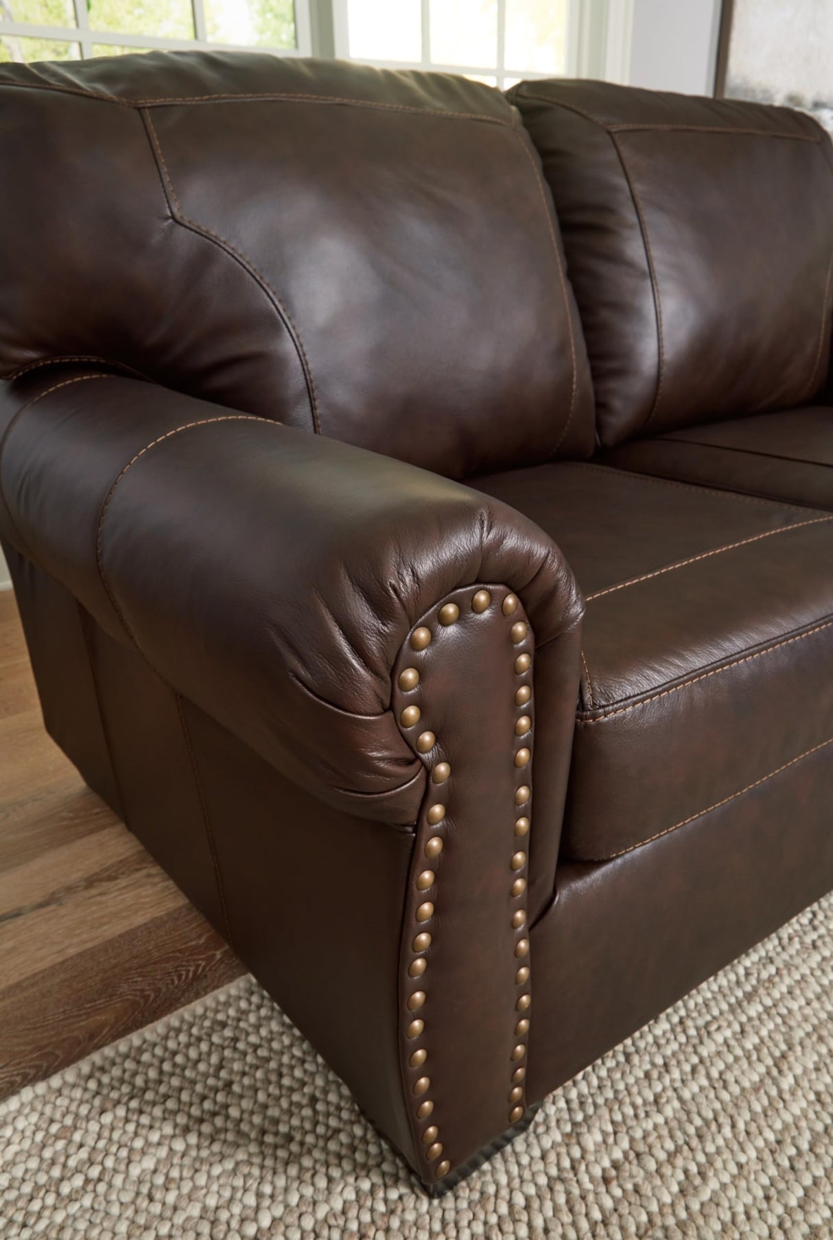 Signature Design by Ashley Colleton Classic Leather Match Loveseat with Nailheads, Dark Brown Signature Design by Ashley
