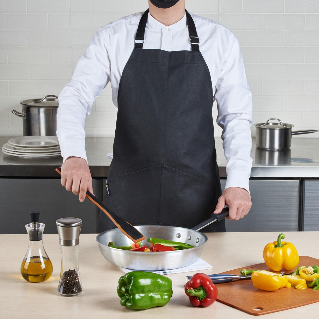 Restaurantware 32 x 26 Inch Cooking Apron 1 Flame Retardant Chef Apron - Adjustable Neck Straps For Men And Women Black Cotton Kitchen Apron Grill Bake Or Paint Durable Restaurantware