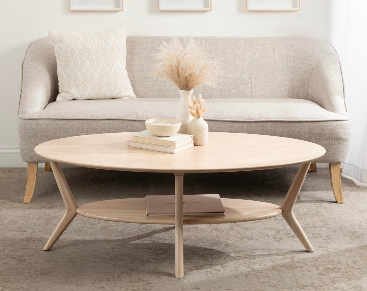 Kate and Laurel Nylah Oval Wooden Coffee Table; 48 x 26 x 18; Light Natural; Transitional Tiered Living Room Table with Solid Wood Construction and Sculptured Dowel Legs Kate and Laurel