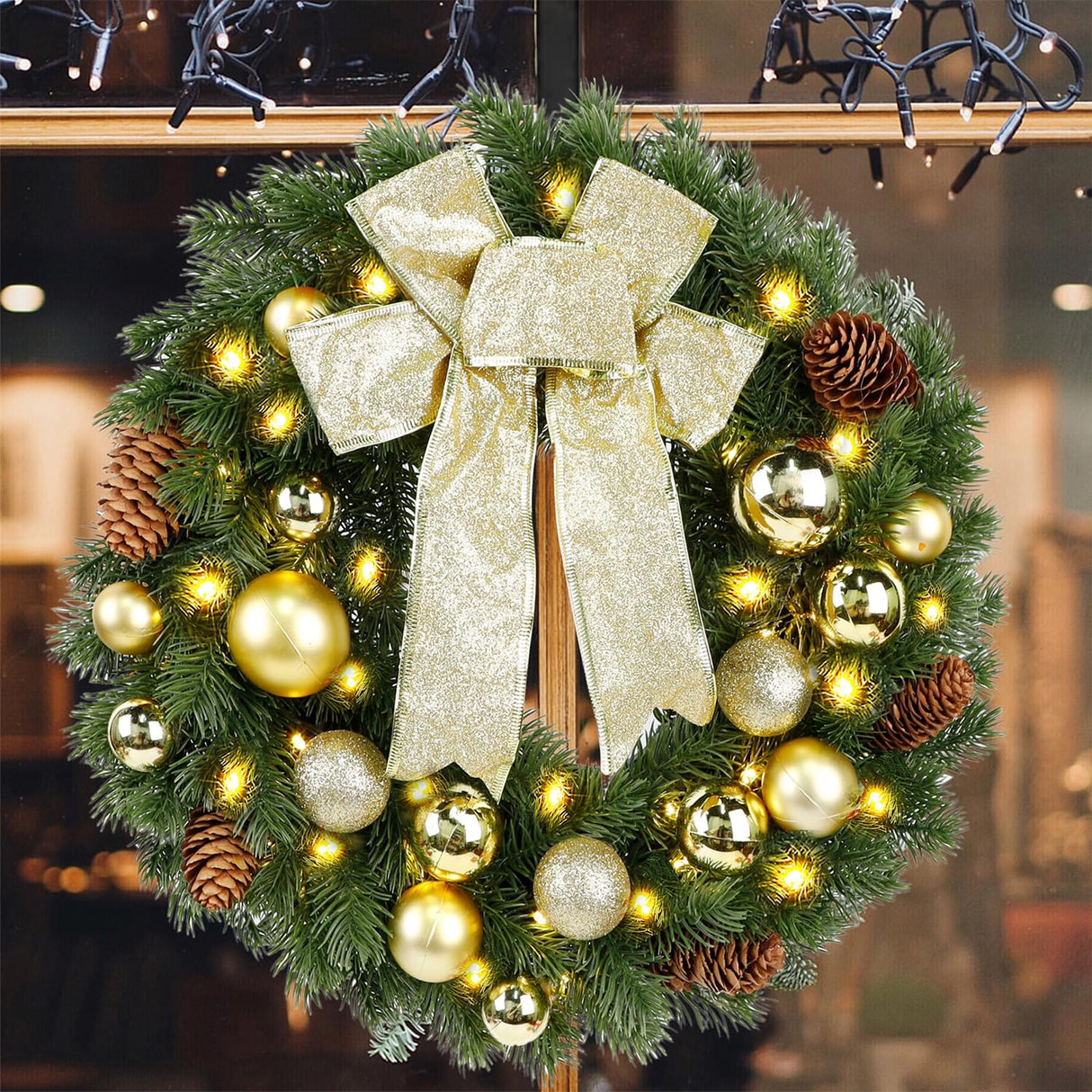 Hausse Lighted Christmas Wreath with Metal Hanger, Pre-lit Xmas Wreath with Large Golden Bow & Balls, 8 Modes & Timer, Battery Operated with 40 Lights, for Front Door Gate Wall Xmas Party Decorations Hausse