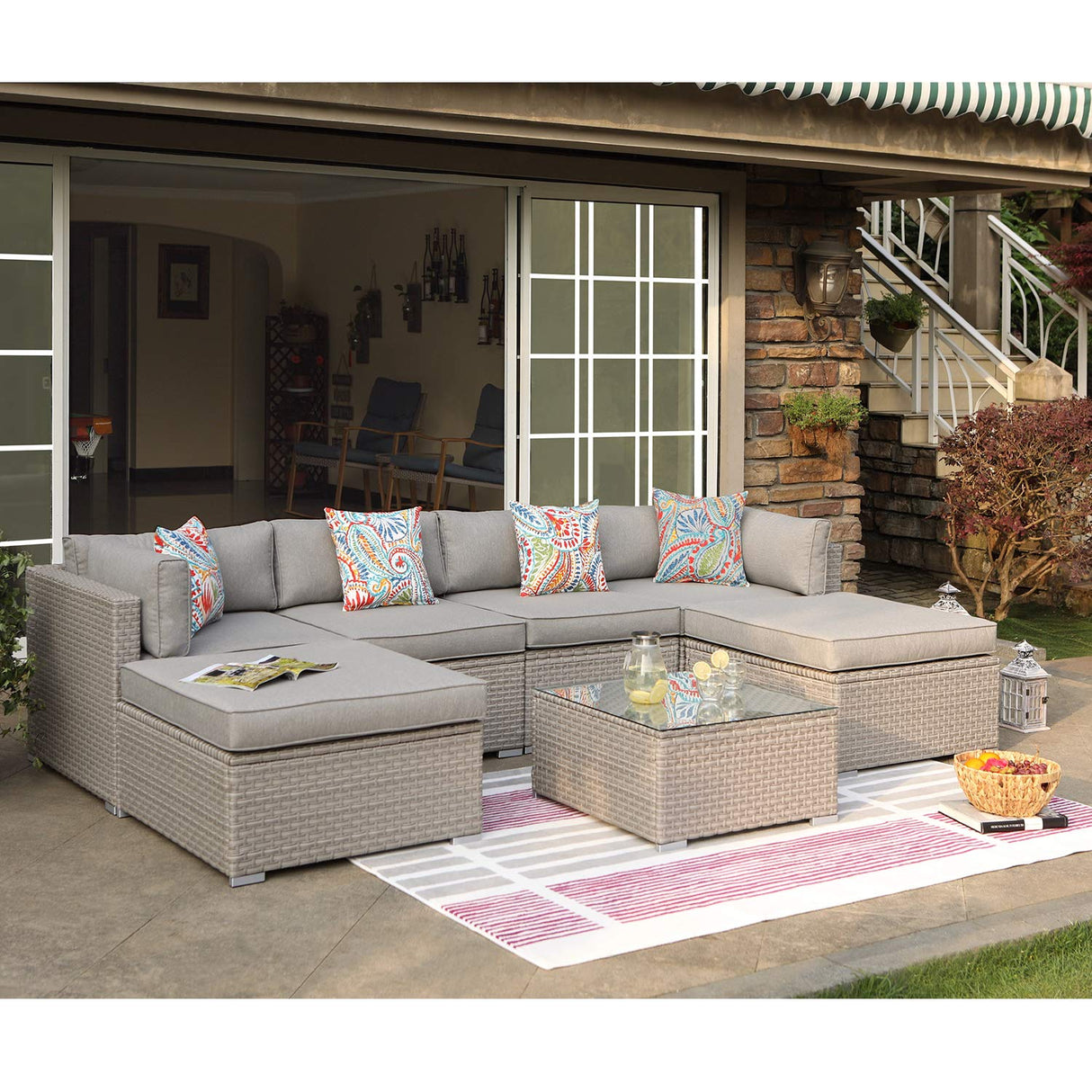 COSIEST 7-Piece Outdoor Furniture Warm Gray Wicker Family Sectional Sofa w Thick Cushions, Glass Top Coffee Table, 2 Ottomans, 4 Floral Fantasy Pillows for Garden, Pool, Backyard COSIEST