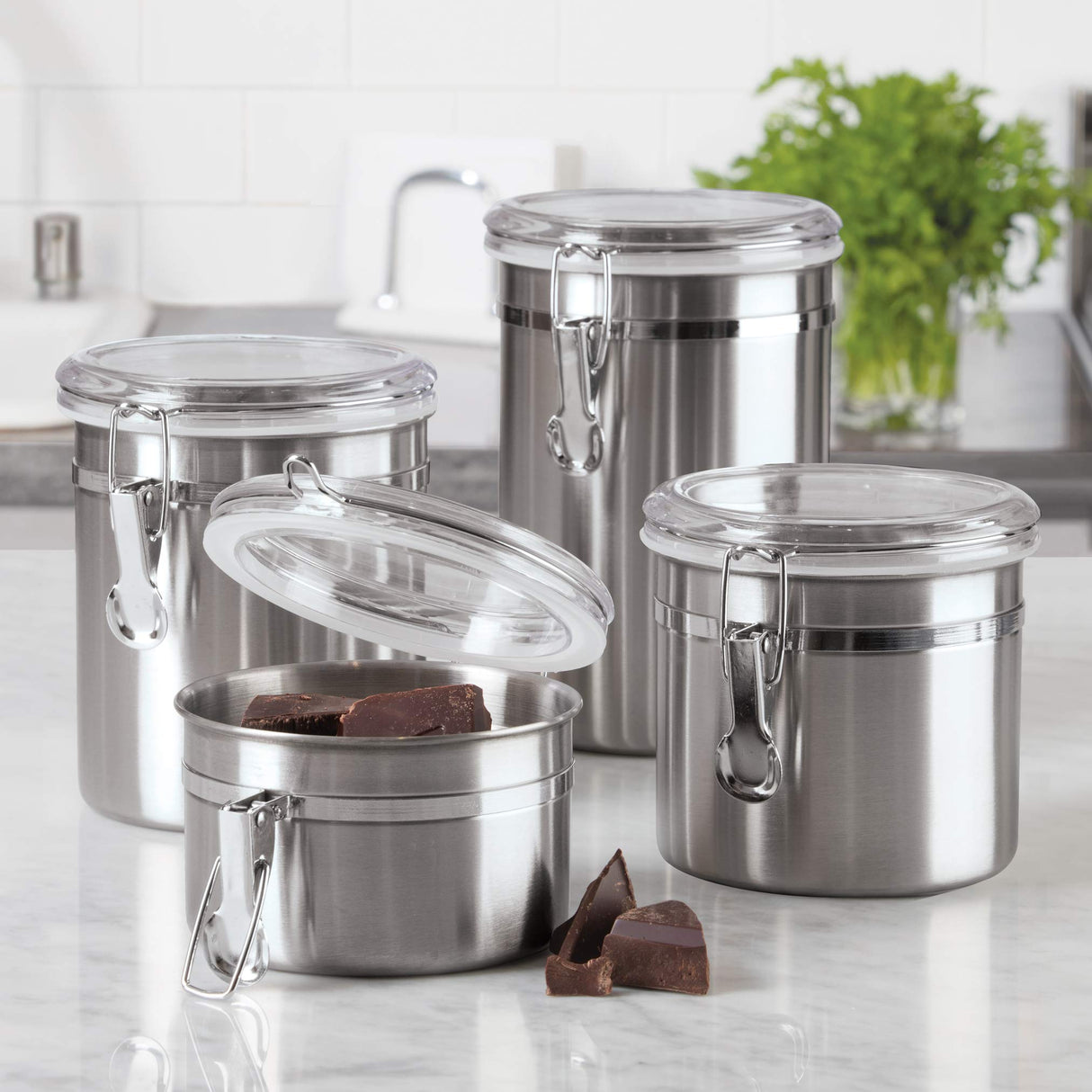 Oggi Set of 4 Stainless Steel Kitchen Canisters - Airtight Clamp Lid, Clear See-Thru Top - Ideal for Kitchen Storage, Food Storage, Pantry Storage - Includes 1 each: 26oz, 36oz, 47oz, 62oz. Oggi