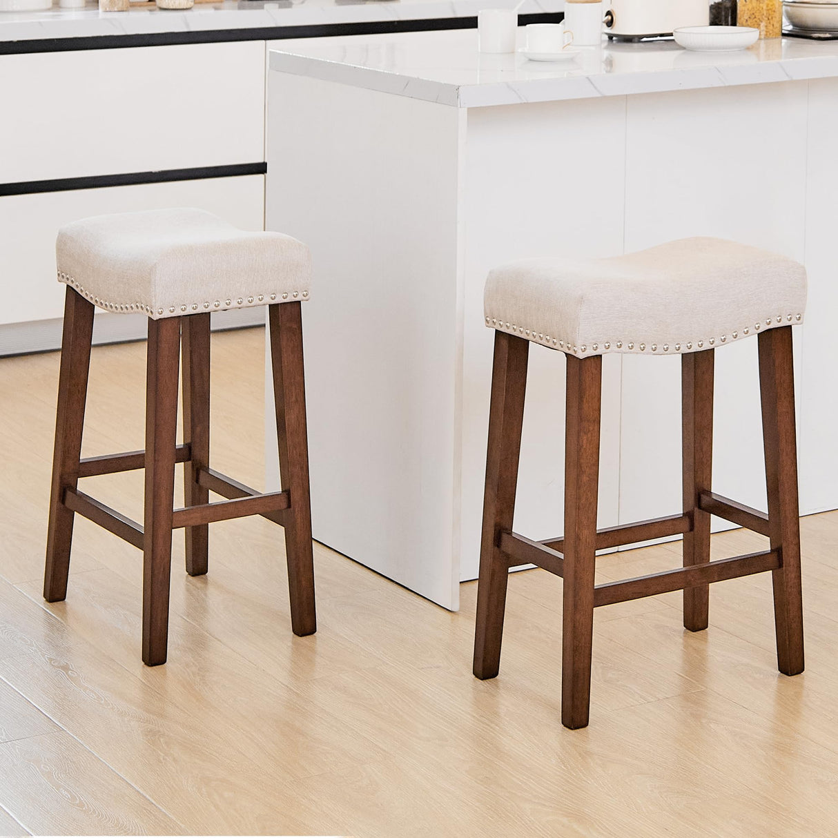 PrimeZone Counter Height Bar Stools Set of 2 - Backless Saddle Barstools with 4.3" Thick Upholstered, Nailhead Trim Linen Fabric & Solid Wood Legs, 26 Inch Counter Stools for Kitchen Island, Beige PrimeZone