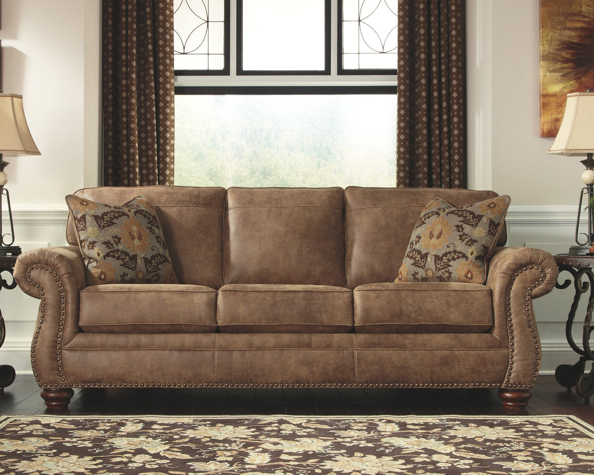 Signature Design by Ashley Larkinhurst Faux Leather Sofa with Nailhead Trim and 2 Accent Pillows, Brown Signature Design by Ashley