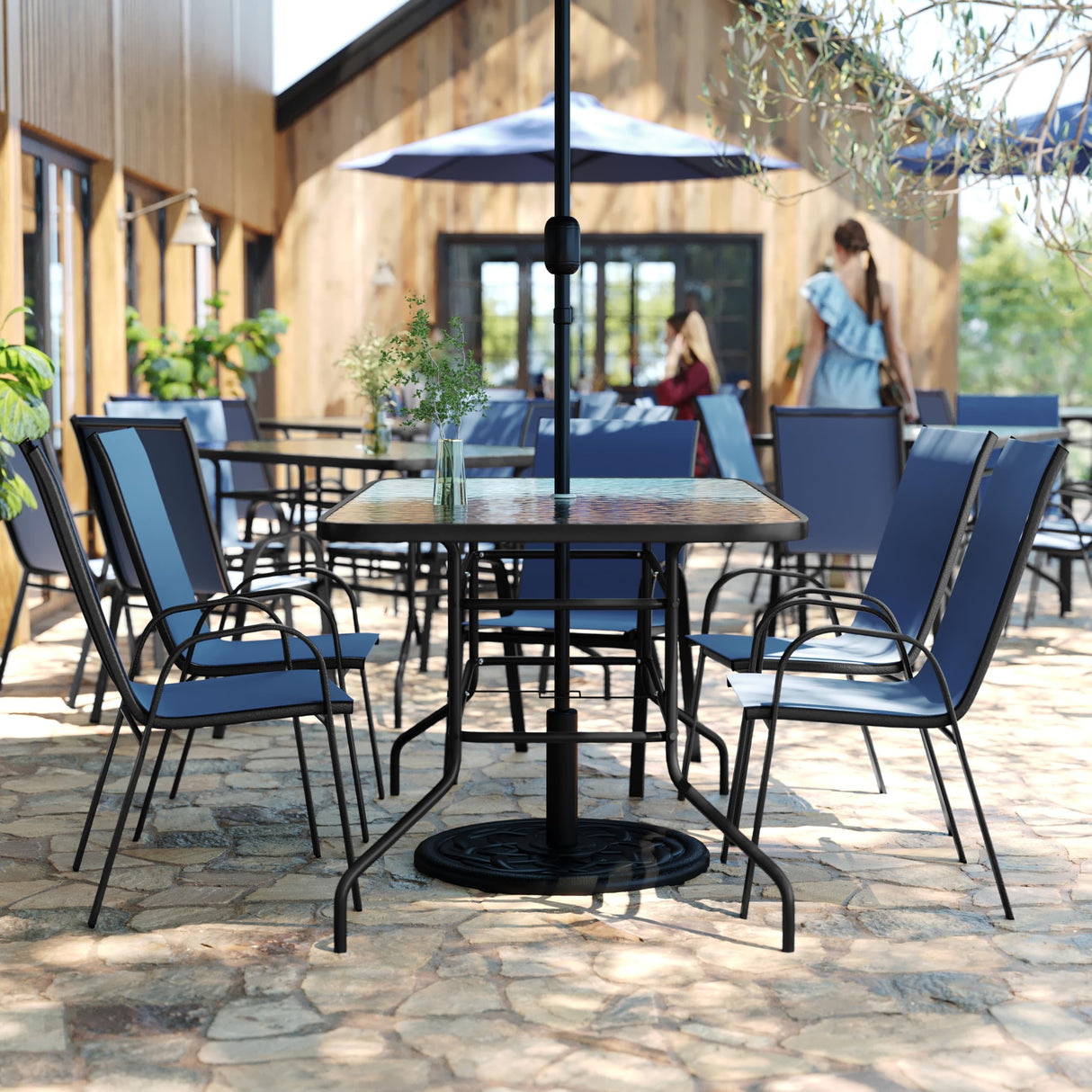 Flash Furniture Brazos 7 Piece Outdoor Patio Dining Set - 6 Navy Flex Comfort Stack Chairs - 55" Tempered Glass Patio Table with Umbrella Hole Flash Furniture