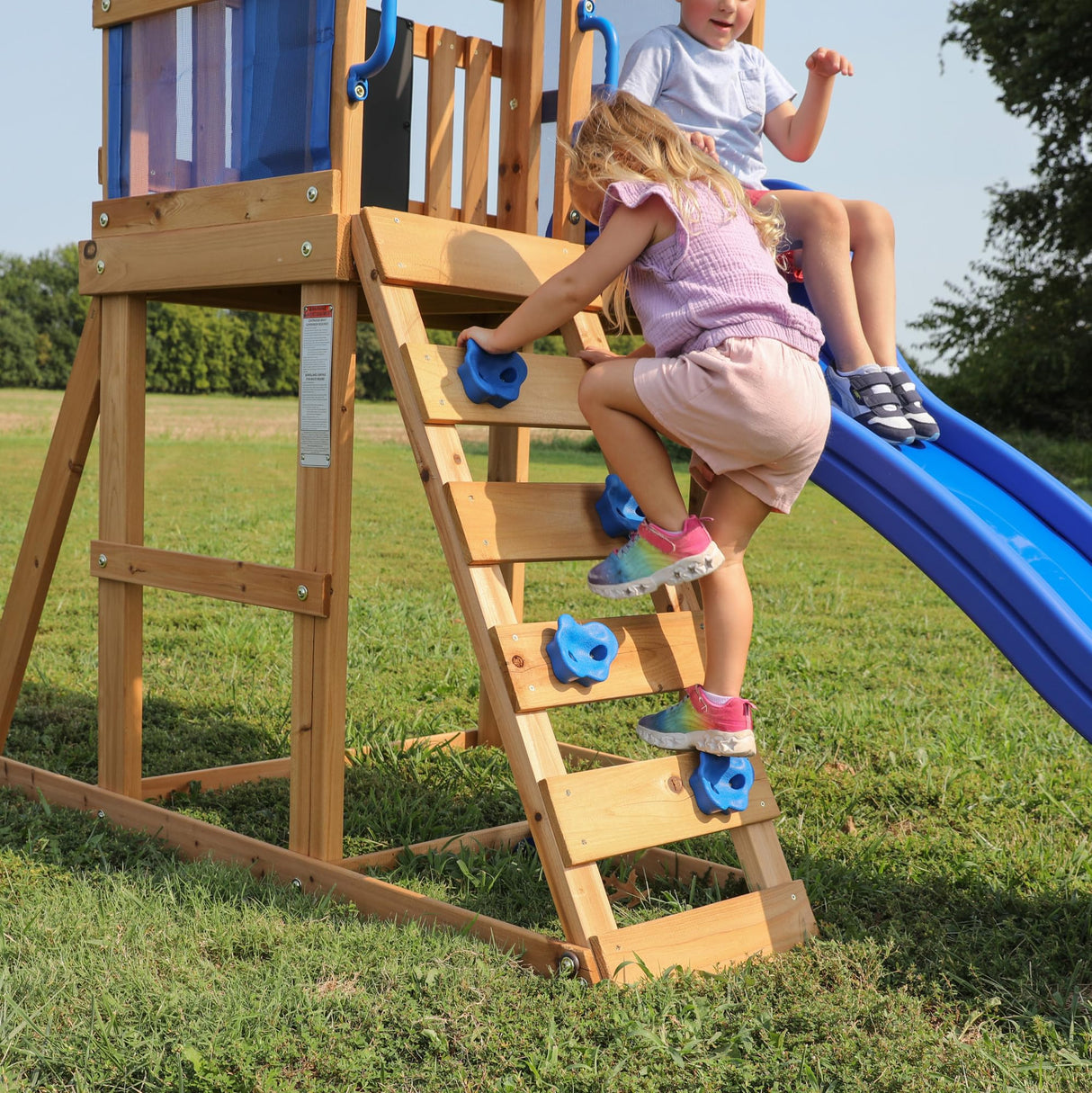Backyard Discovery Bay Pointe All Cedar Wooden Swing Set, Large Upper Deck with Canopy, Sandbox, Rock Wall, Slide, Two Swings, Chalkboard Blue Backyard Discovery