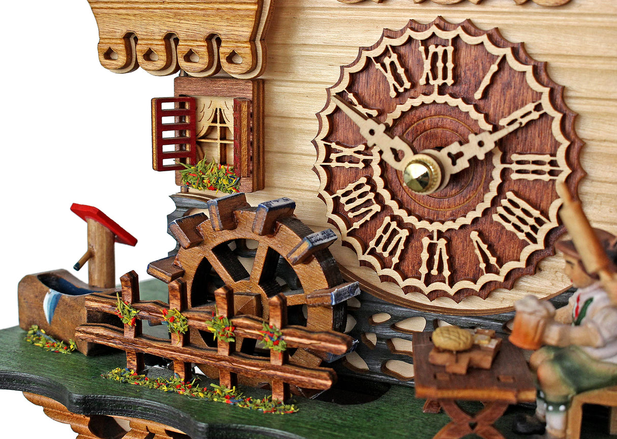 Trenkle Quartz Cuckoo Clock Black Forest House with Moving Black Forest Woman and Mill Wheel, with Music TU 4215 QM Trenkle