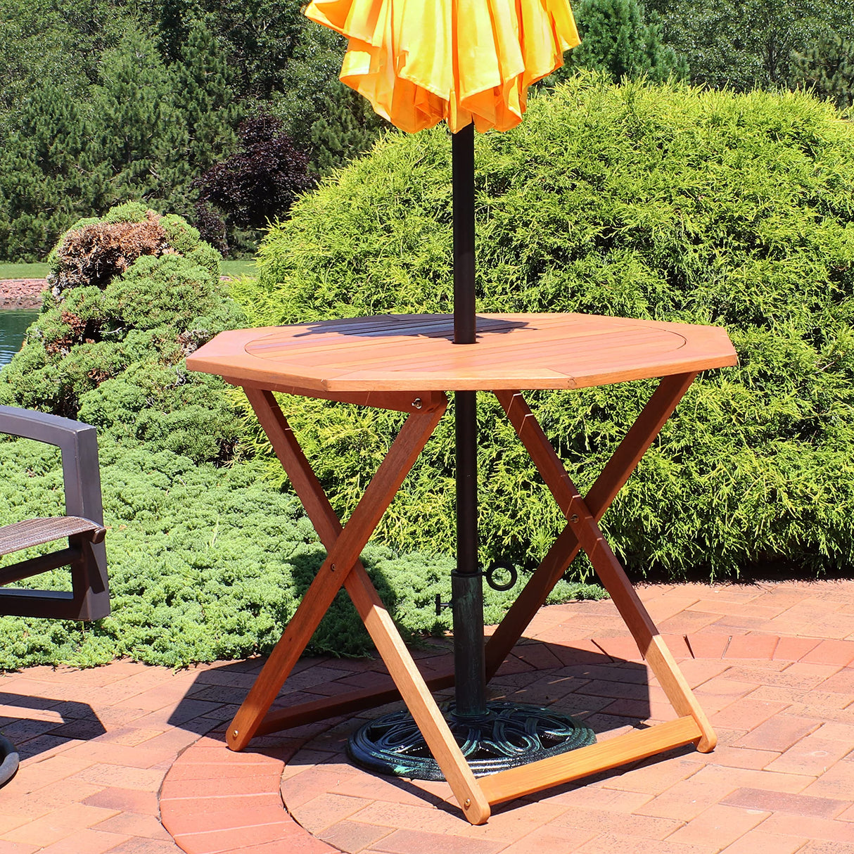 Sunnydaze Folding Meranti Wood Outdoor Dining Table with Umbrella Hole - Foldable Teak Patio Table - Teak Oil Finish - Octagon Sunnydaze