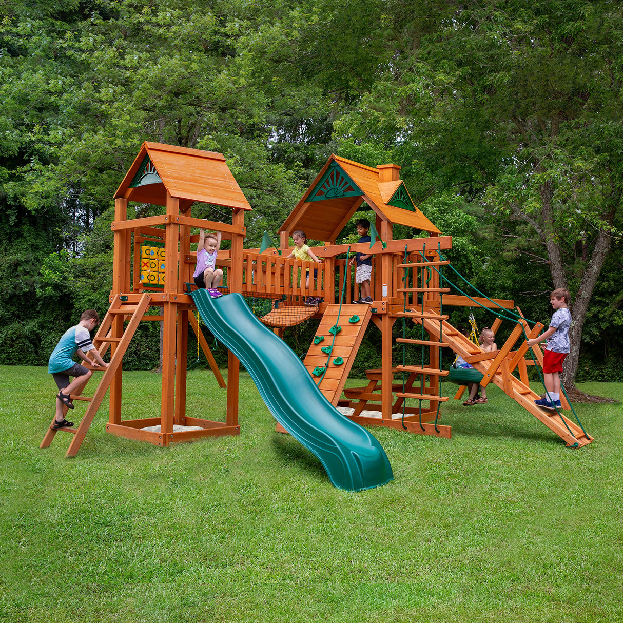 Gorilla Playsets 01-0006-AP Pioneer Peak Wood Swing Set with Wood Roof, Tire Swing, Clatter Bridge and Tower, Ramp, Slide, Two Swings, Amber Gorilla Playsets