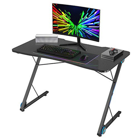 Tangkula Gaming Computer Desk, Z-Shaped Home Office Computer Table with LED Lights & Large Carbon Fiber Surface, Ergonomic Gamer Workstation, Writing Desk for Home Office Tangkula