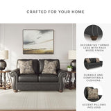 Signature Design by Ashley Chatterton Rustic Faux Leather Sofa with Nailhead Trim and 2 Throw Pillows, Black Signature Design by Ashley