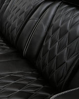 Signature Design by Ashley Boyington Contemporary Leather Match Power Reclining Sofa with Adjustable Headrest, Cup Holder, USB Charging Ports, Air Massage System and LED Lighting, Black Signature Design by Ashley