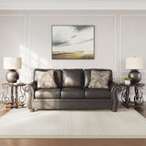 Signature Design by Ashley Chatterton Rustic Faux Leather Sofa with Nailhead Trim and 2 Throw Pillows, Black Signature Design by Ashley