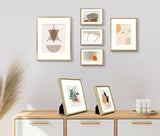 Frametory, Aluminum Picture Frames Set of 7 - Gold Gallery Wall Kit - Displays One 11x14, Two 8x10, and Four 5x7 inch Photos for Home Decoration Frametory