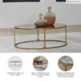 Signature Design by Ashley Korajane Oval Coffee Table with Tempered Glass Top, Faux Marble Finish, Steel Frame, 48" W x 27.38" D x 17.5" H, Antique Gold Signature Design by Ashley