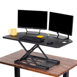X-Elite Pro 40" Corner Standing Desk Converter with Pneumatic Lift | Adjustable Sit to Stand Riser, L-Shaped Desks & Cubicles | Fully Assembled Computer Workstation (Matte Black) Stand Steady