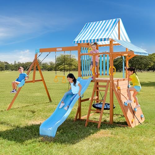 Teamson Kids Wooden Swing Sets for Backyard Outdoor Playset with Slide Rock Wall Trapeze Bar Fireman Pole Pirate Wheel Kids Playground with Swingset Holds 9 Children Ages 3 to 10 Teamson Kids