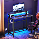 YATINEY Small Computer Desk with Charging Station and LED Lights, Gaming Desk with Monitor Stand, 2-Tier Home Office Desk with 4 Side Hooks, for Living Room, Home Office, Black DN01UDBBY2 YATINEY