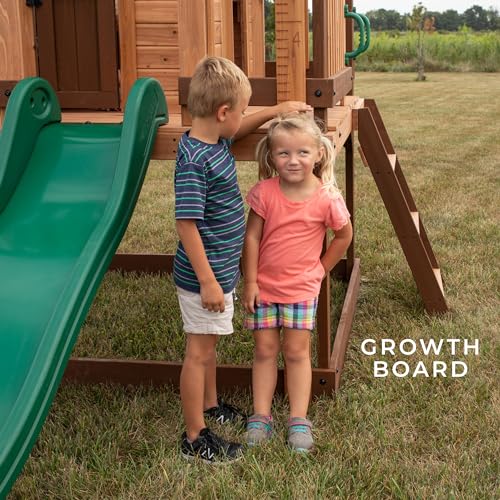 Backyard Discovery Echo Heights Elevated Cedar Playhouse, Play Kitchen, Powered Blender, Working Bell, 6 ft Wave Slide, Wrap-Around Deck, Flat Step Ladder, Growth Chart Backyard Discovery