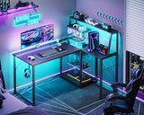 MOTPK 45 Inch L Shaped Gaming Desk with Power Outlet & LED Lights, Computer Table with Corner Desktop Showcase for CPU Stand, Display Storage Shelf, Carbon Fiber Surface, Black MOTPK