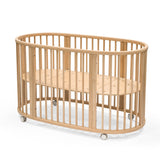 Stokke Sleepi Bed, Natural - Oval Crib Suitable for Ages 0-5 Years Old - Adjustable, Stylish & Flexible - Sturdy Beech Wood Frame Stokke