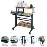 Mobile Standing Desk, Adjustable Rolling Computer Desk with 3 Desktops, Portable Laptop Table with Cup Holder, Home Office Laptop Workstation on Lockable Wheels, Grey Oak Panta