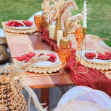 DELAQIKO 13.8" Round Corn Husk Placemats | Boho Woven Rattan Table Mats | Natural Spring Farmhouse Plate Chargers | Handmade Rustic Wicker Place Mats for Christmas Wedding (Set of 4) DELAQIKO