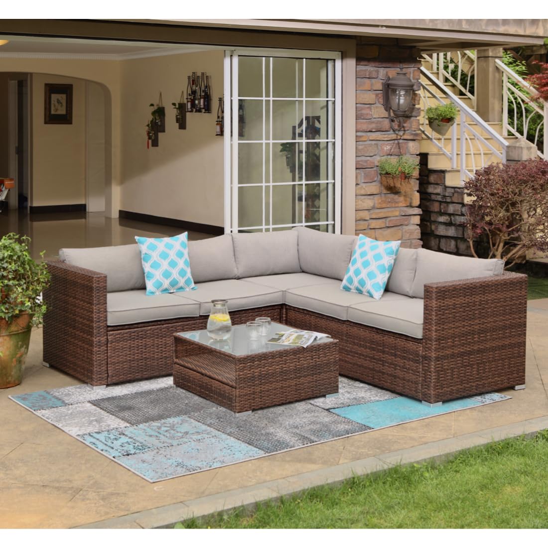 COSIEST 4-Piece Outdoor Furniture Set All-Weather Brown Wicker Sectional Sofa w Warm Gray Thick Cushions, Glass Coffee Table, 2 Teal Pattern Pillows COSIEST
