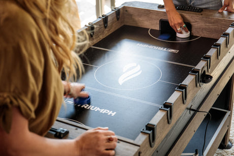 56” 4-in-1 Swivel Multi-Game Table - Air Hockey, Billiards, Foosball, Ping Pong - Rustic Wood Grain Finish, Brown Triumph
