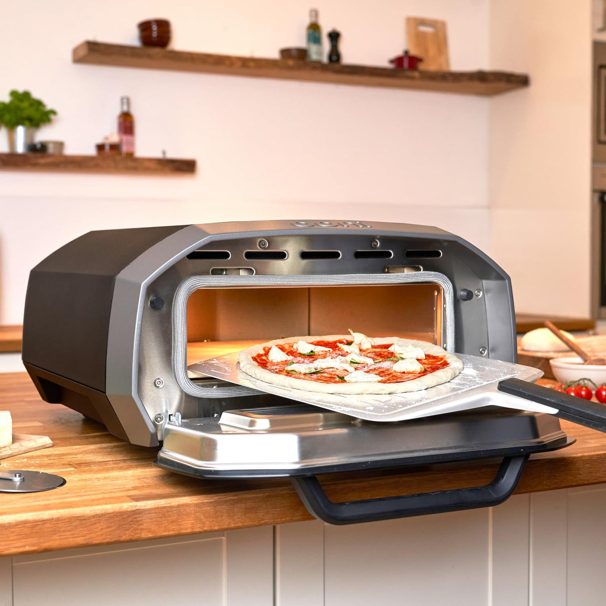 Ooni Volt 12 Electric Pizza Oven - Indoor & Outdoor Versatile Electric Oven, Pizza Cooker with Stone, Indoor and Outdoor Toaster Oven Countertop, Portable Pizza Oven, Cook 12 Inch Pizzas and More ooni