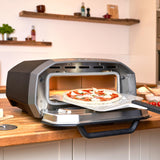 Ooni Volt 12 Electric Pizza Oven - Indoor & Outdoor Versatile Electric Oven, Pizza Cooker with Stone, Indoor and Outdoor Toaster Oven Countertop, Portable Pizza Oven, Cook 12 Inch Pizzas and More ooni
