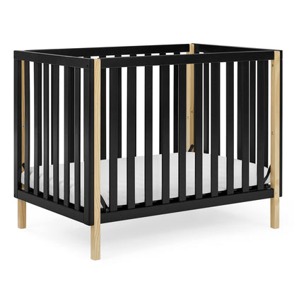 Delta Children Gio Mini Crib with 2.75" Mattress Included, Ebony/Natural