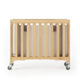 Foundations Travel Sleeper Compact Wooden Folding Crib, Portable Baby Crib with 2” InfaPure Foam Crib Mattress and Commercial Grade Casters, Hotel Crib (Natural) Foundations