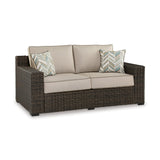Signature Design by Ashley Coastline Bay Casual Weather Resistant Outdoor Loveseat with Cushion and 2 Throw Pillows, Beige & Dark Brown Signature Design by Ashley