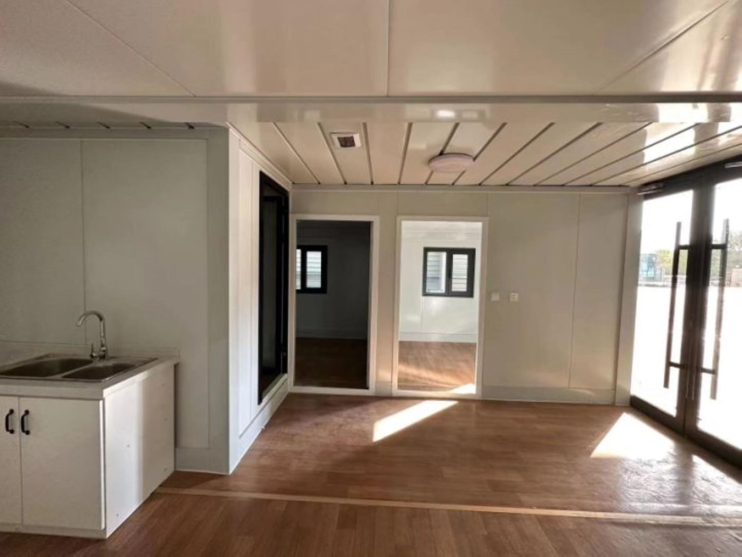 S.E.Q Double Story, Fully Equipped Bathroom, and Kitchen Tiny prefab Container House. Home with Glass sunroom and Stairs Free Water Heater (20 ft)