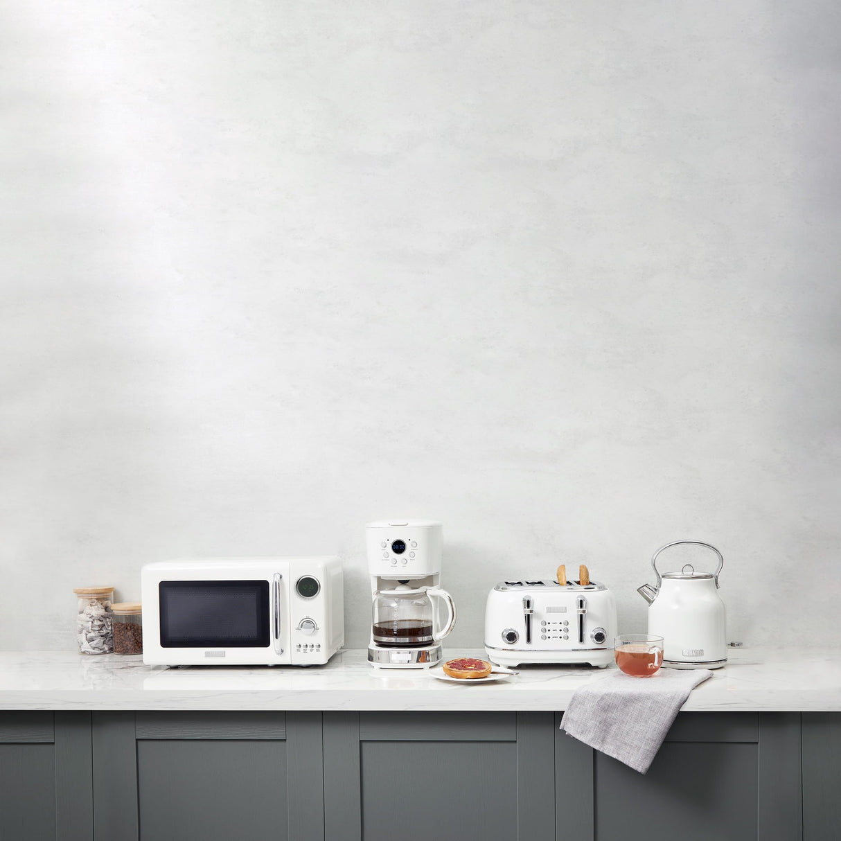 Haden 700 Watt 0.7 Cubic Foot Microwave Oven with Digital Controls, Defrost, and Instant Start Countertop Small Appliance, Ivory/Chrome HADEN