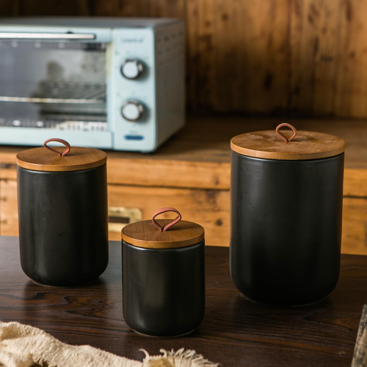 JOJUNO Black Ceramic Canister Set with Wooden Lid, 3-Piece Airtight Food Storage Jars for Kitchen Counter - Flour, Sugar, Coffee, Tea, Spice - Small, Medium, Large Sizes JOJUNO