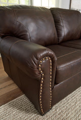 Signature Design by Ashley Colleton Classic Leather Match Loveseat with Nailheads, Dark Brown Signature Design by Ashley