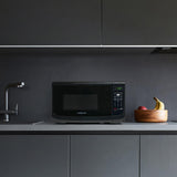 Farberware Countertop Microwave 700 Watts, 0.7 Cu. Ft. - Microwave Oven With LED Lighting and Child Lock - Perfect for Apartments and Dorms - Easy Clean Grey Interior, Retro Black Farberware