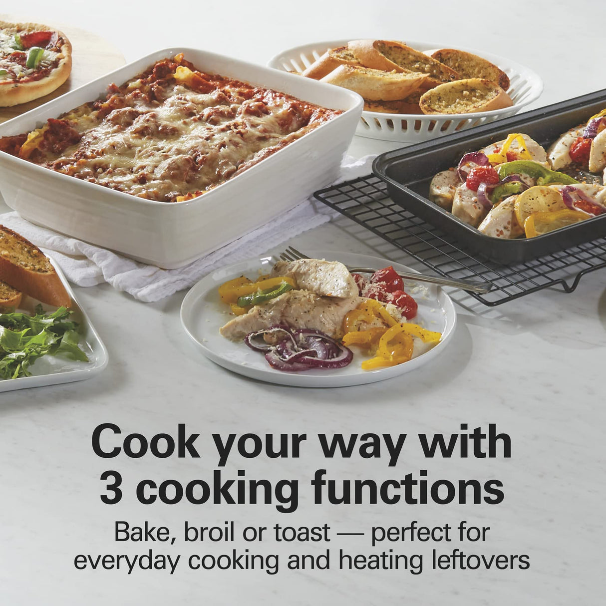 Hamilton Beach Easy Reach 4-Slice Countertop Toaster Oven With Roll-Top Door, 1200 Watts, Fits 9” Pizza, 3 Cooking Functions for Bake, Broil and Toast, Silver (31344DA) Hamilton Beach