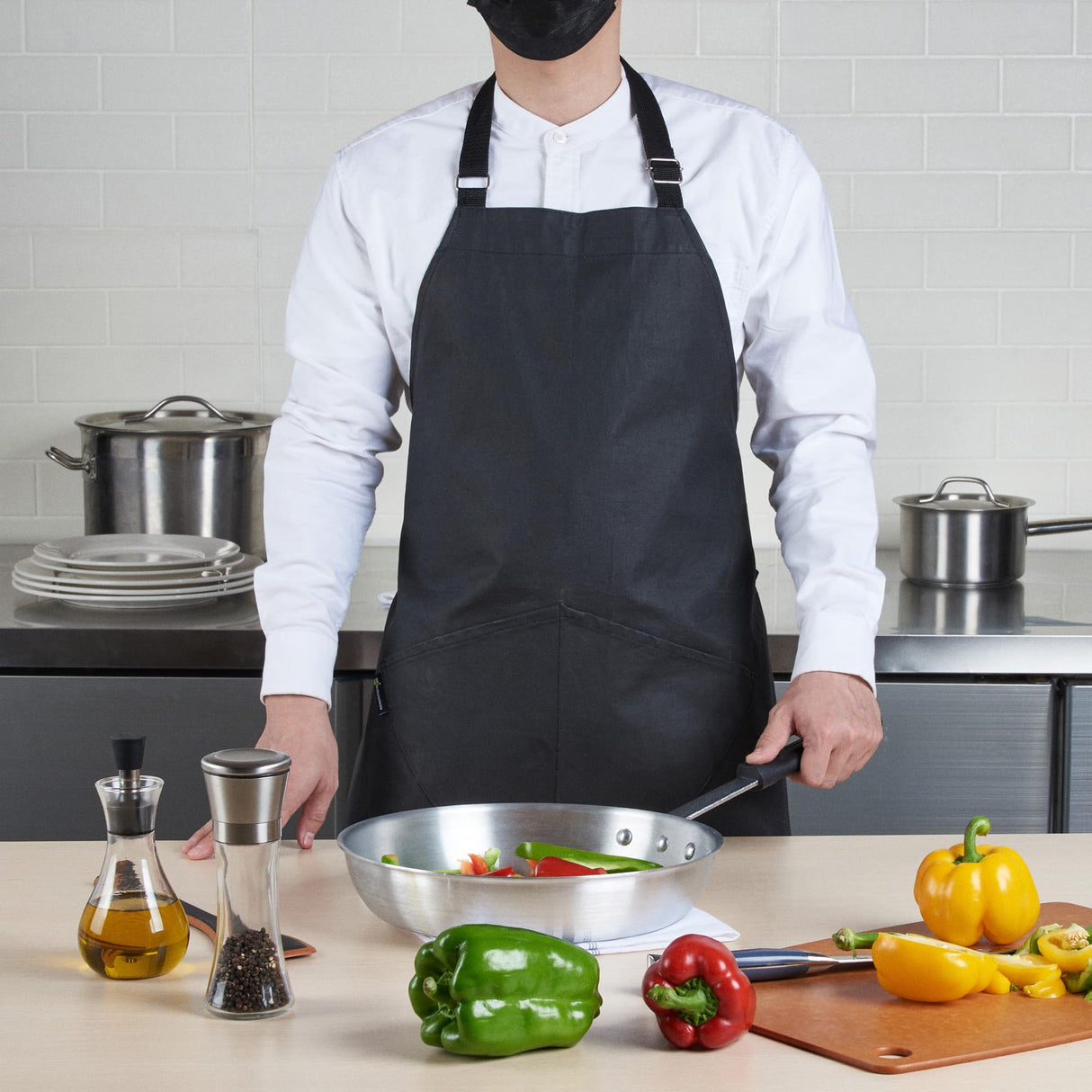 Restaurantware 32 x 26 Inch Cooking Apron 1 Flame Retardant Chef Apron - Adjustable Neck Straps For Men And Women Black Cotton Kitchen Apron Grill Bake Or Paint Durable Restaurantware