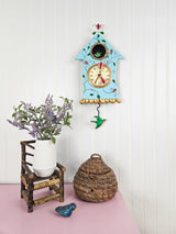 Enesco Allen Designs Birdhouse with Flowers Cuckoo Wall Clock - Battery Operated Pendulum Analog Clock, Stone Resin Decorative Clocks for Walls Home Decor Kitchen Clocks, 14.9 Inch Enesco