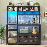 Itaar 47.2 Inch Bakers Rack with Power Outlet, Microwave Stand with Storage, Farmhouse Coffee Bar Cabinet Station with Wine Rack, Iron Grid and 8-S Hooks (Black) Itaar