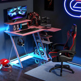 Tangkula L Shaped Gaming Desk with Power Outlets, Small Gaming Computer Desk 39inch with Storage Shelf, Corner Desk with Carbon Fiber Texture, Gamer Desk Gaming Table (Pink) Tangkula