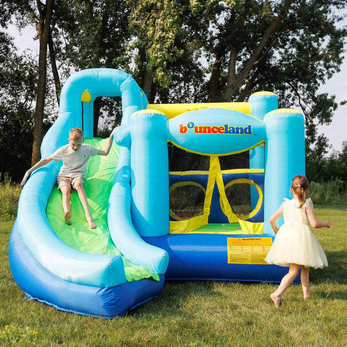 Bounceland Ultimate Combo Inflatable Bounce House, 12 ft L x 10 ft W x 8 ft H, Basketball Hoop, Obstacle Wall, Fun Tunnel, Slide and Bounce Area for Kids Bounceland