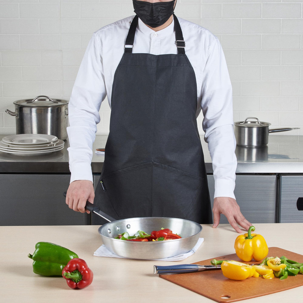 Restaurantware 32 x 26 Inch Cooking Apron 1 Flame Retardant Chef Apron - Adjustable Neck Straps For Men And Women Black Cotton Kitchen Apron Grill Bake Or Paint Durable Restaurantware